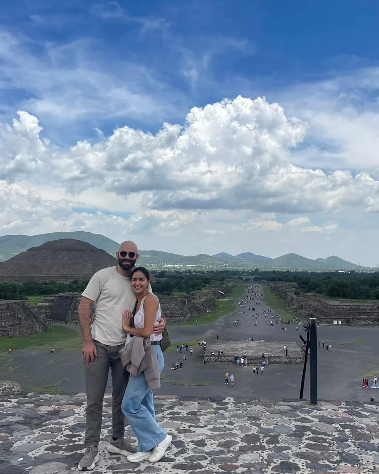 Nora and Marc on the pyramid steps at Teotihuacán, looking out over the Avenue of the Dead